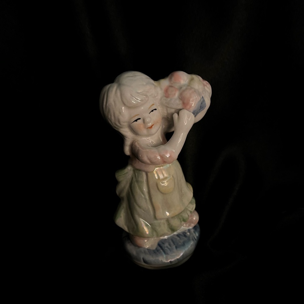 A GIRL WITH HER FRUIT BASKET FIGURINE